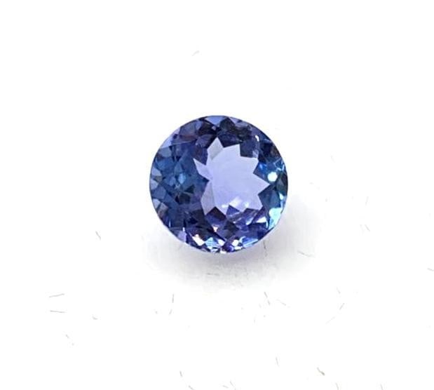 0.65ct Round Faceted Tanzanite Gemstone: Tanzanite is a rare and precious gemstone, which has been coined a geographical phenomenon because of the unusual formation of the stone. The only known source this stone can be found in is a thin