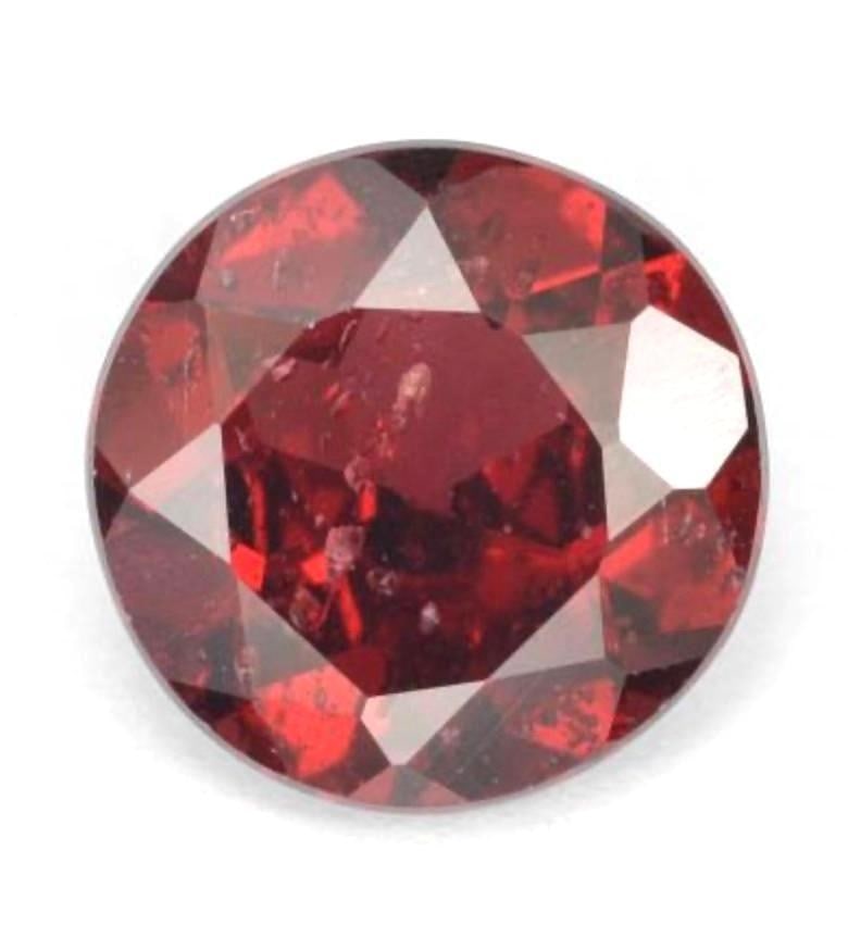 1.57ct Cherry Red Round Rhodolite Garnet Gemstone: 1.57ct Cherry Red Round Rhodolite Garnet Gemstone Size: 7mm (Diameter) x 3.9mm (Depth) Color: Purple-Red Clarity: VS-SI Treatment: Untreated Origin: Mozambique Mohs Hardness: 6.5-7.5 View Photos For