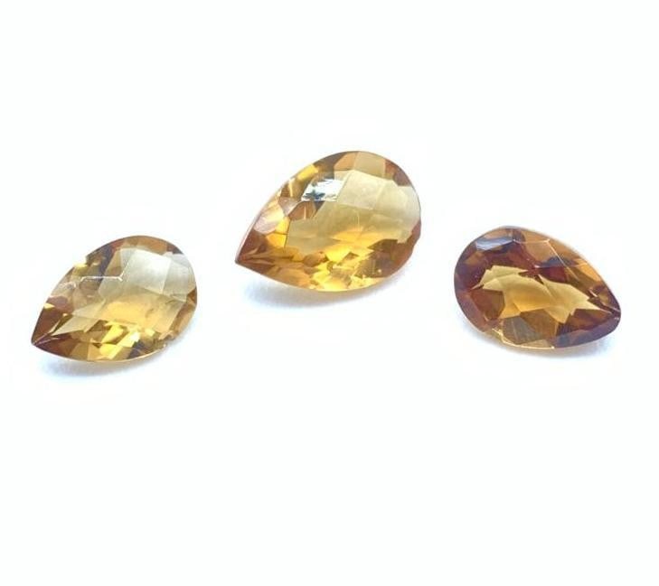 5.6tcw AAA Fancy Pear Checker Cut Cognac Citrine Gemstones: 5.6tcw AAA Fancy Pear Checker Cut Cognac Citrine Gemstones The AAA grade ensures that these cognac citrine gemstones possess remarkable clarity and brilliance, allowing them to radiate a golden glow t