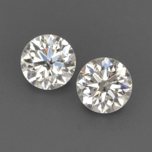 0.17ct Diamond-Cut White Diamonds Pair: 0.17ct Diamond-Cut White Diamonds Pair Raw Dimension: 2.7 x 2.7mm Exact Size: 2.72mm Diameter x 1.72mm Depth Total Carat Weight: 0.17 Individual Carat Weight: 0.09ct Clarity: VVS-VS Treatment: