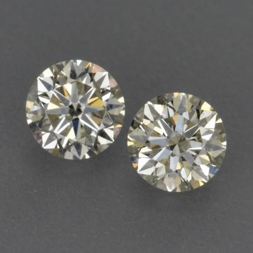 0.22ct Diamond-Cut Warm White Diamonds: 0.22ct Diamond-Cut Warm White Diamonds This lot contains a pair of diamond-cut Diamonds, each at 0.11ct Raw Dimension: 3 x 3mm Total Carat Weight: 0.22ct Treated: No Please view photos for further
