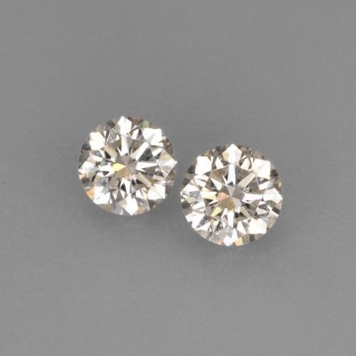 0.15ct Diamond-Cut Warm White Diamonds: 0.15ct Diamond-Cut Warm White Diamonds This lot contains a pair of diamond-cut Diamonds, each at 0.08ct Raw Dimension: 2.8 x 2.8mm Total Carat Weight: 0.15ct Treated: No Please view photos for
