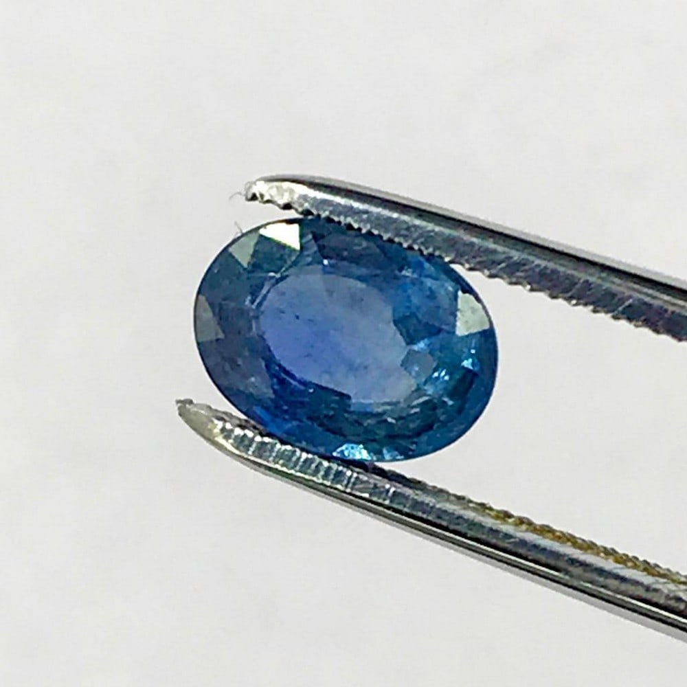 1.53ct Deep Blue Faceted Sapphire Oval Gemstone: Deep Blue Faceted Sapphire Oval Sapphire is a gemstone associated with royalty. It is believed to attract abundance, blessings, and gifts. It has been used to protect against negative energies, as