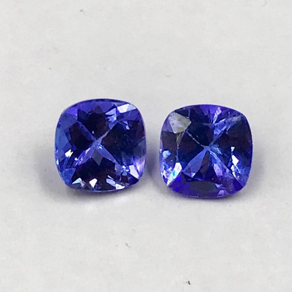 1.77ct Pair of Faceted Tanzanite Cushion Gemstones: Pair of Faceted Tanzanite Cushions Tanzanite gems are believed to represent heart and intellect combined with intuition and purity. These stones are used as symbols of dignity, truth, judgement and