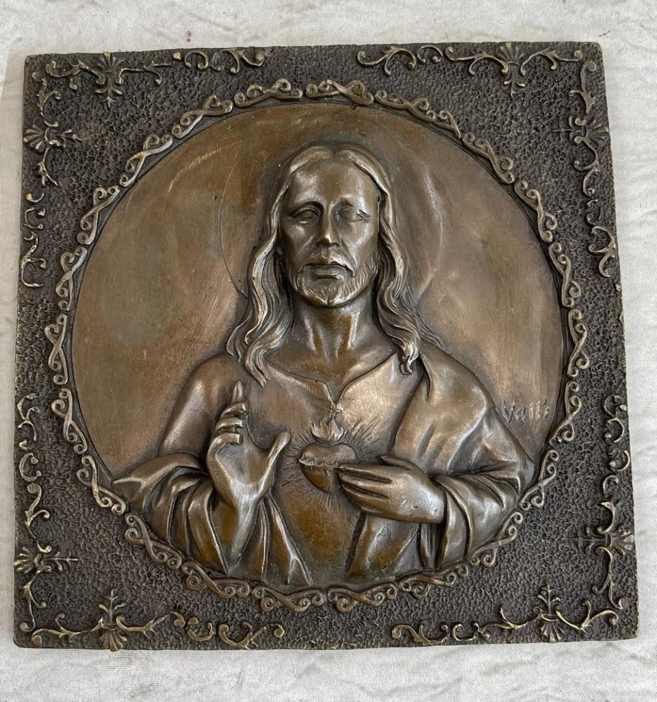 Jesus Christ Wall Mount Original Bronze - 6'' x 6'': Jesus Christ Mall Mount Original Bronze - 6" x 6" This piece portrays a bronze wall mount depicting Jesus Christ, a central figure in Christianity. The relief shows Christ with one hand raised