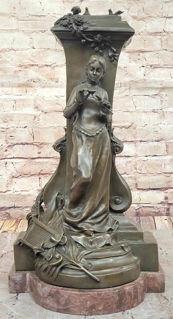 A Maiden Holding a Flower ''Souvenir'' Bronze Sculpture - 19'' x 10'': A Maiden Holding a Flower " Souvenir" Bronze Sculpture - 19" x 10" This refined bronze sculpture, titled " Souvenir" by Charles Gounod, depicts a graceful maiden holding a delicate