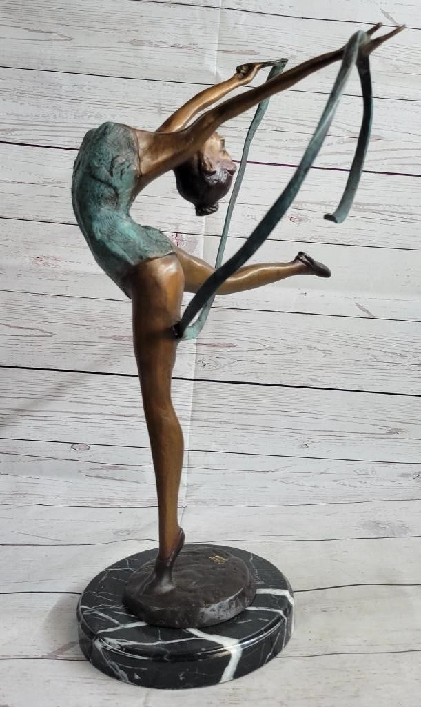 Graceful Dancer in Motion Original Bronze Sculpture by Collett - 21.5'' x 14'': Graceful Dancer in Motion Original Bronze Sculpture by Collett - 21.5" x 14" This exquisite bronze sculpture captures the essence of a graceful dancer in the midst of her performance. With her h
