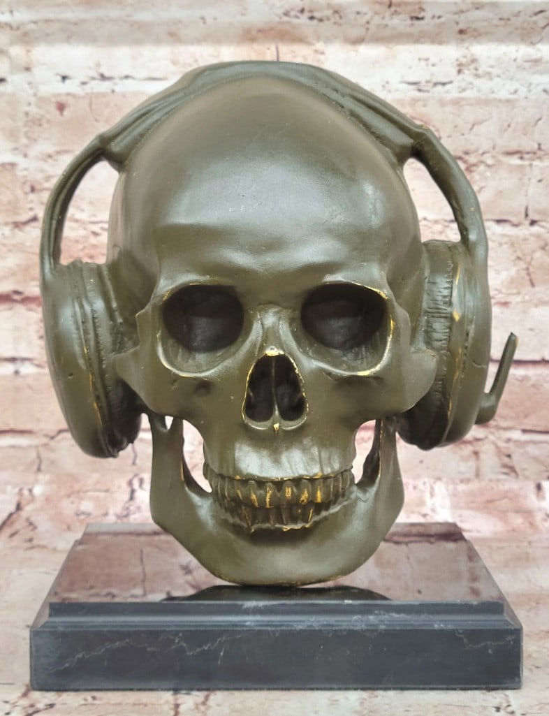 Gothic Skull with Headphones Original Bronze Statue - 10'' x 7'': Gothic Skull with Headphones Original Bronze Statue - 10" x 7" This bold bronze sculpture by Miguel Lopez reimagines the human skull with oversized headphones, merging themes of mortality and mo