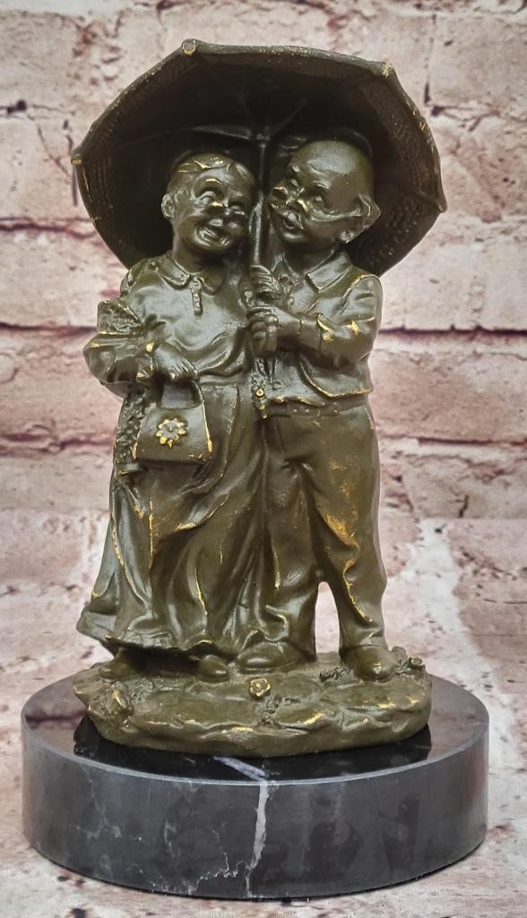 Under the Rain Bronze Sculpture by Cesaro - 8'' x 4.5'': Under the Rain Bronze Sculpture by Cesaro - 8" x 4.5" This exquisite bronze sculpture by Cesaro, titled Under the Rain, beautifully captures an elderly couple huddled together beneath a gentle d
