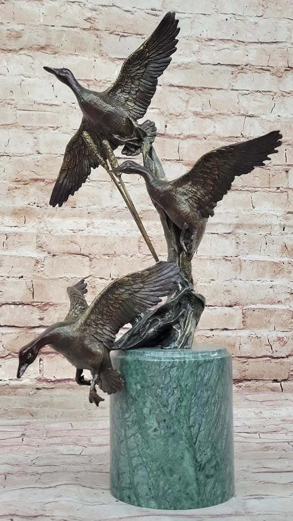 Handcrafted Trio of Flying Ducks Bronze Sculpture - an Enthusiast's Wildlife Art Piece - 18''x: Handcrafted Trio of Flying Ducks Bronze Sculpture - an Enthusiasts Wildlife Art Piece - 18" x 11.5" Immerse yourself in the beauty of nature with our Handcrafted Trio of Flying Ducks Bronze Scul