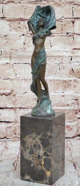 The Unveiling Woman Bronze Sculpture: The Unveiling Woman Bronze Sculpture This statue is a conceptual representation of a nude girl standing upright with a cloth loosely wrapped around her. Her hands are covered by a cloth that encircles