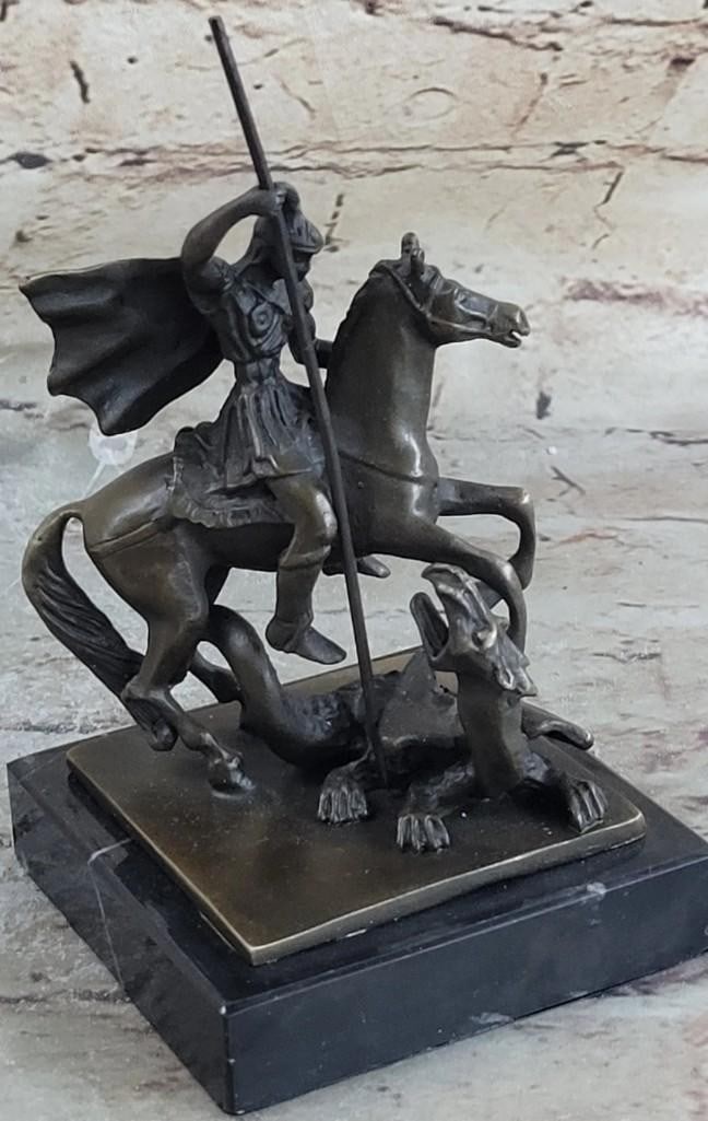 St. George Dragon Slayer Catholic Bronze Sculpture: St. George Dragon Slayer Catholic Bronze Sculpture Ladies, have you always dreamed of having a Knight in Shining Armor sweep you off of your feet? Gentlemen, do you long for adventure and wish that