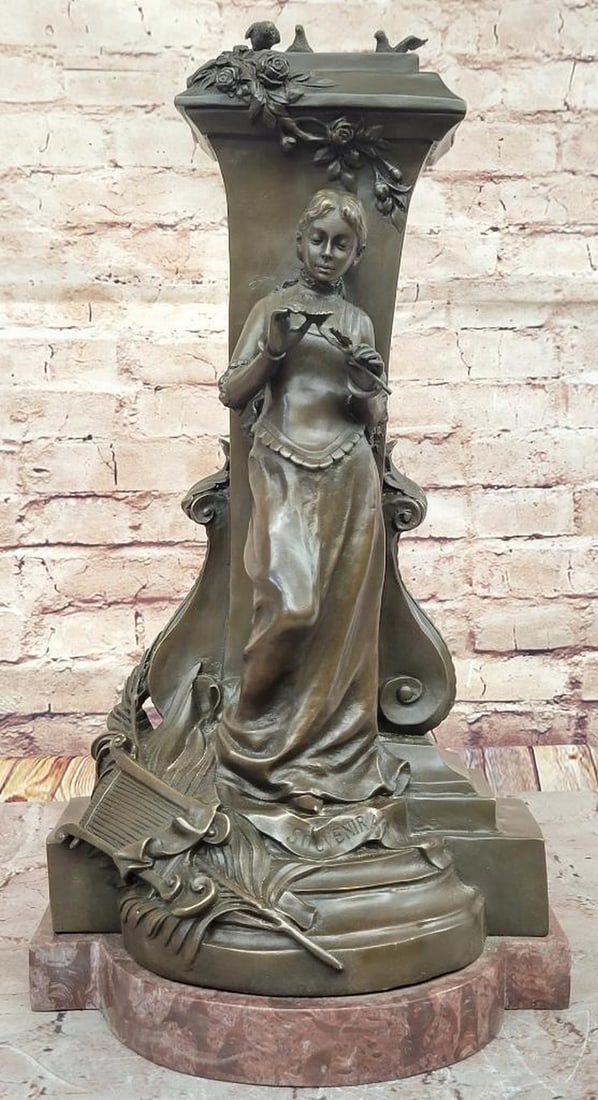 A Maiden Holding a Flower "Souvenir" Bronze Sculpture - 19" x 10": A Maiden Holding a Flower "Souvenir" Bronze Sculpture - 19" x 10" This refined bronze sculpture, titled "Souvenir" by Charles Gounod, depicts a graceful maiden holding a delica
