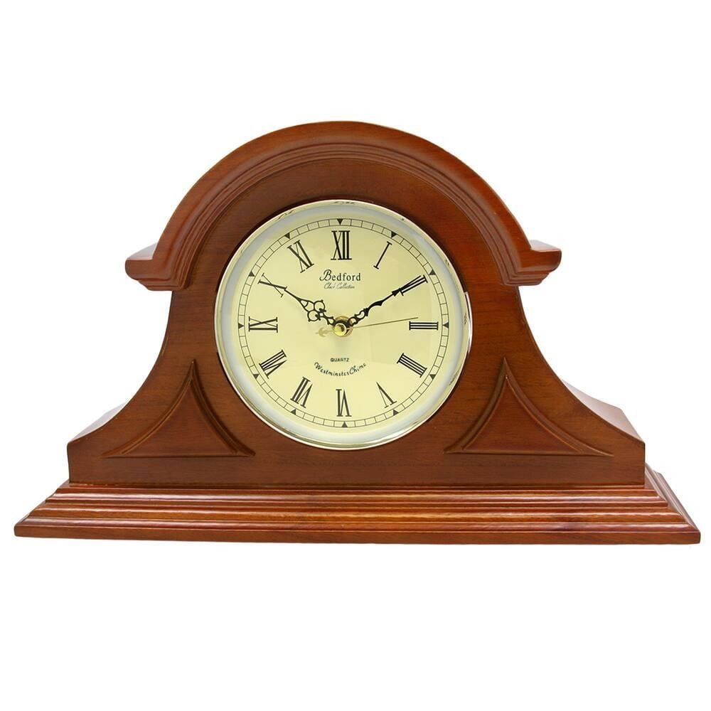 Mahogany Cherry Quartz Mantel Clock: Mahogany Cherry Quartz Mantel Clock This elegant mantel clock features a mahogany cherry oak-finished wooden case with a glass-enclosed dial. Roman numerals with black spade hands and polished