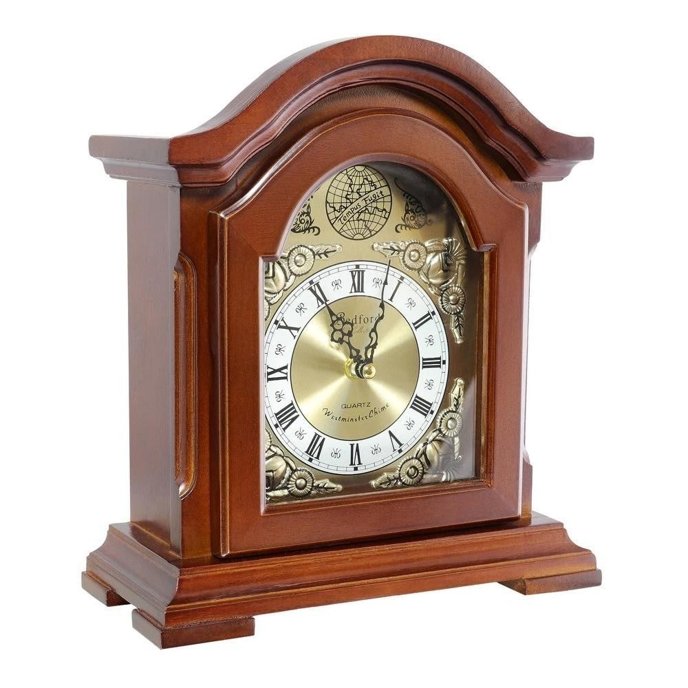 Redwood Oak Quartz Mantel Clock: Redwood Oak Quartz Mantel Clock This classic mantel clock features a redwood oak finish with a glass-enclosed dial highlighting Roman numerals and black spade hands. Its handcrafted wooden case includ