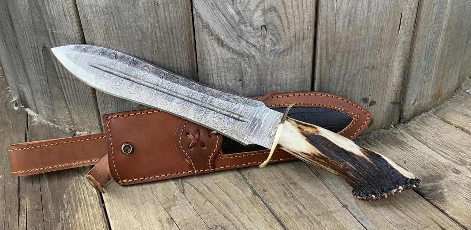Of The Forest Brown Bone Handle Damascus Straight Blade Hunting Knife: Of The Forest Brown Bone Handle Damascus Straight Blade Hunting Knife This large hunting knife is a blend of rugged functionality and timeless craftsmanship, making it an essential tool for outdoor en