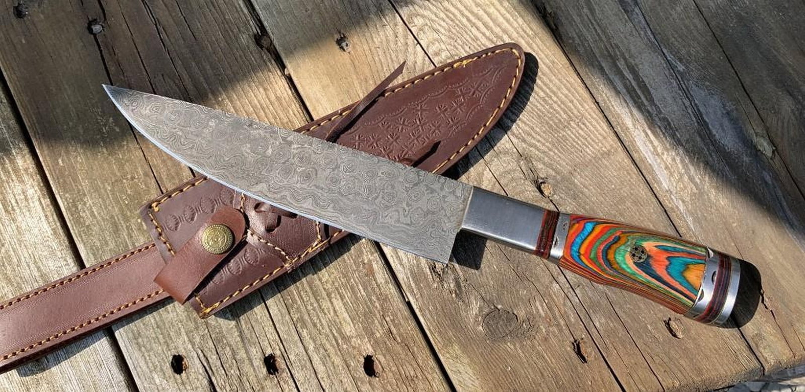13" The Outback Damascus Chef's Knife: 13" The Outback Damascus Chef's Knife Introducing our Custom Handmade Damascus Steel Hunting Chef Knife, a culinary masterpiece that seamlessly blends artistry and functionality. The multi-color