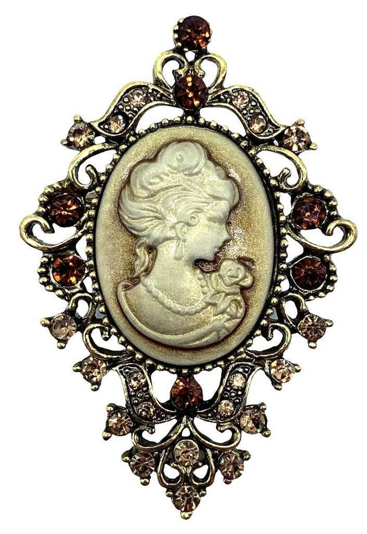 Vintage Gold and Red Cameo Brooch With Silhouette Of A Beauty: Vintage White Cameo Brooch With Orange and Peach Colored Gems. This brooch will add charm and elegance to any clothing item. It is fashionable and easy to wear. It would make a great gift for your fri