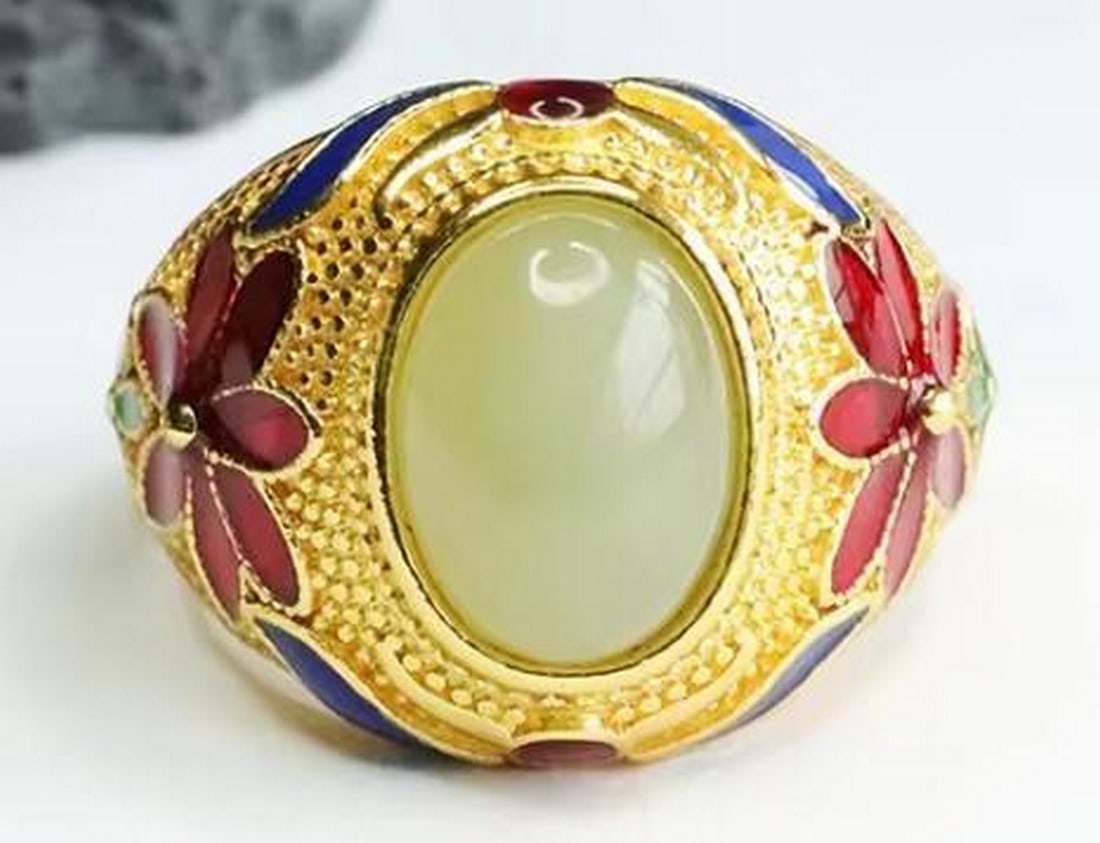 Harmony White Jade Ring: Harmony White Jade Ring Elevate your elegance with this Gold Plated White Jade Ring. This stunning piece combines the pristine beauty of white jade with the luxurious glow of gold plating, making it a