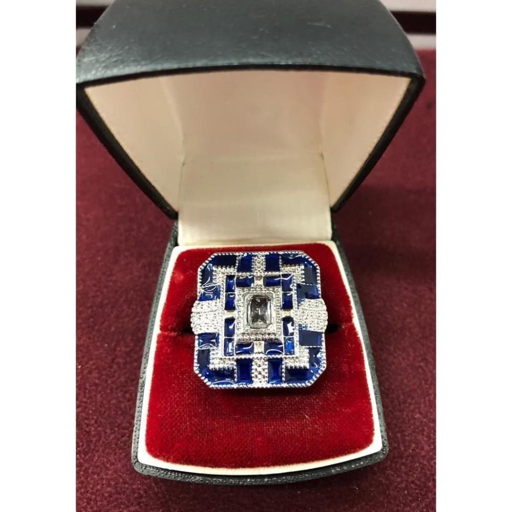 Ladies Blue And Silver Semi Precious Ring: Ladies Blue And Silver Semi Precious Rhinestone Ring Add a touch of refined sparkle to your look with this ladies' blue and silver semi-precious rhinestone ring. Featuring vibrant blue stones framed