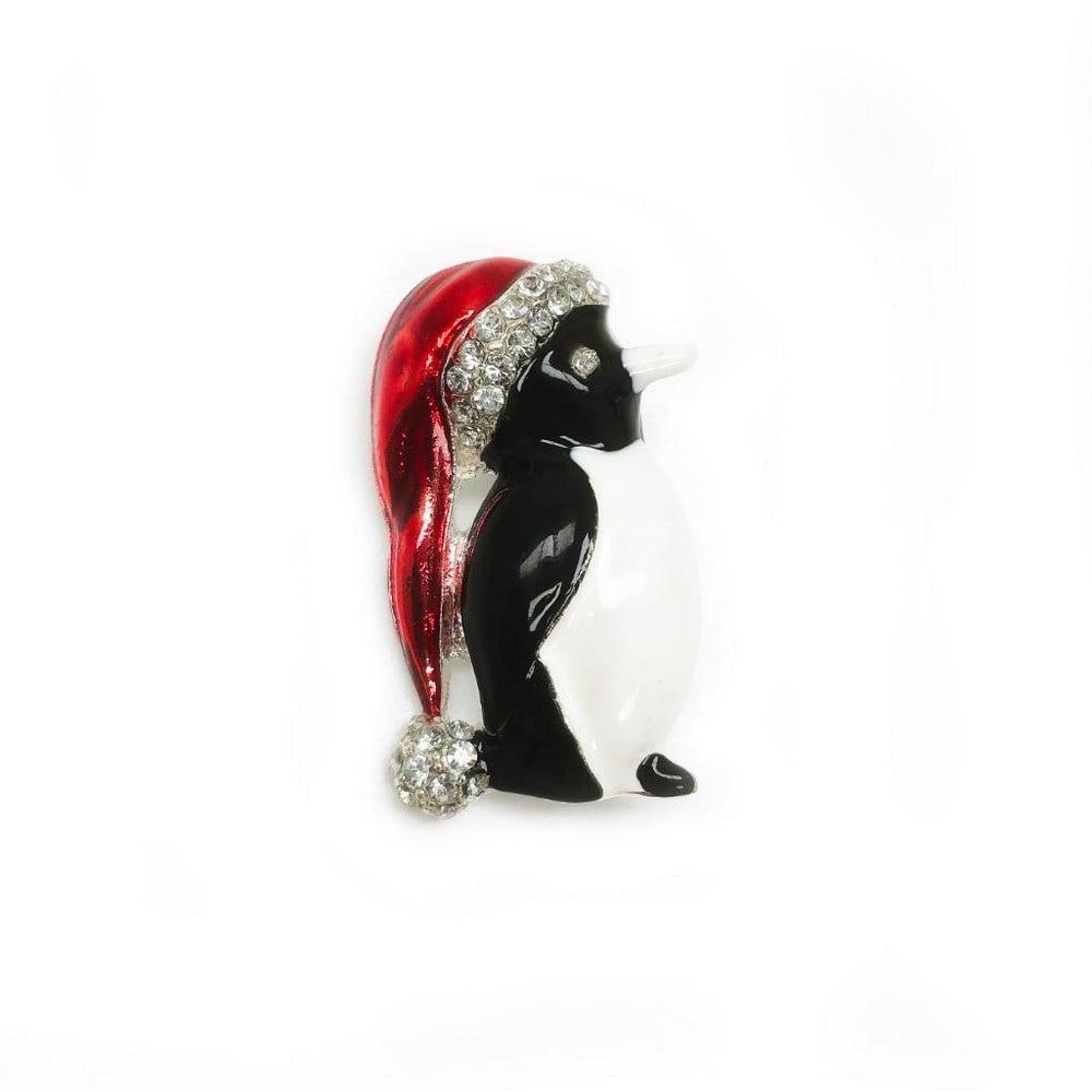 Enameled & Bejewelled Christmas Penguin Brooch: An Enameled & Bejewelled Christmas Penguin Brooch Celebrate the festive season in style with this charming Christmas penguin brooch. Featuring colorful enamel detailing and sparkling jewels, it's a