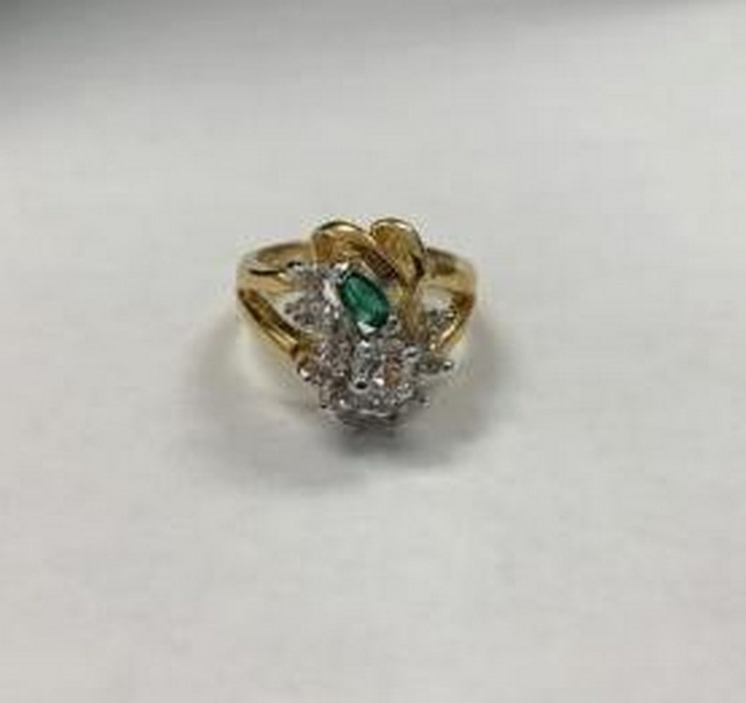Gold Electroplated Cluster Ring: Gold Electroplated Cluster Ring Elevate your style with this striking gold electroplated cluster ring, featuring a sparkling cluster of clear stones highlighted by a single green marquise-cut