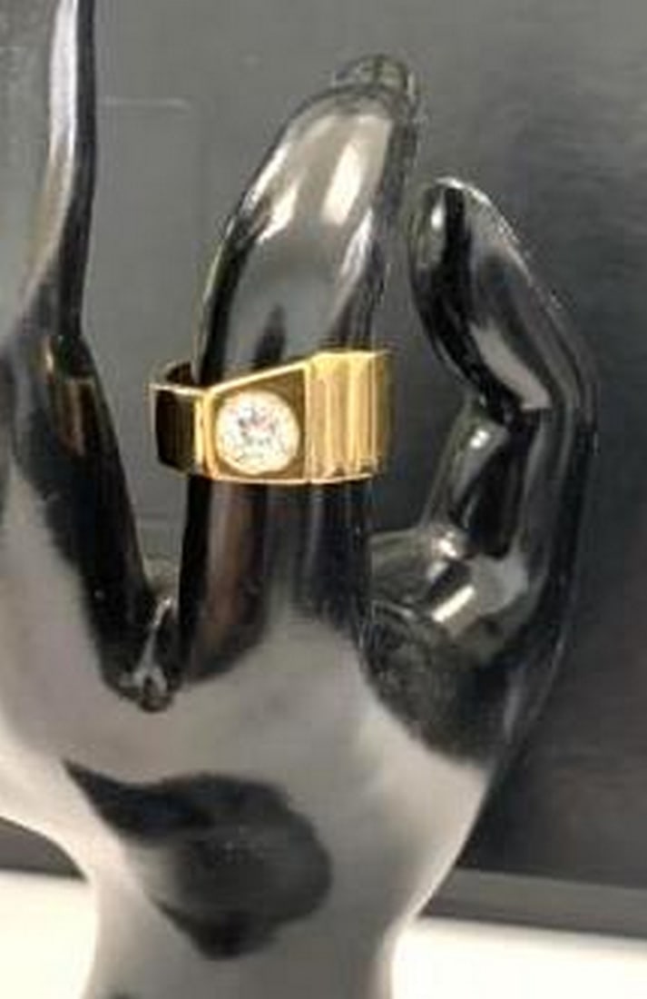 Golden Brilliance: Classic Solitaire Ring with Round-Cut Stone: Golden Brilliance: Classic Solitaire Ring with Round-Cut Stone A stunning embodiment of elegance, this gold ring showcases a prominent round-cut center stone set atop a wide, polished band. The sleek