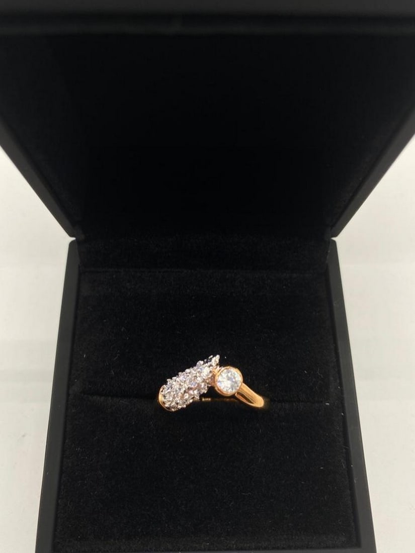 Classy Swarovski Crystal and 18KTGE Yellow Gold Ring: Classy Swarovski Crystal and 18KTGE Yellow Gold Ring This refined ring features a radiant Swarovski crystal set in lustrous 18KTGE yellow gold, offering timeless elegance with a modern touch. The