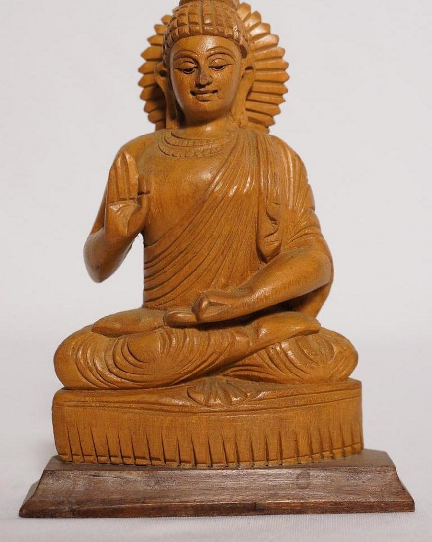 7" Lord Buddha Seated in Vitarka Mudra Handmade White Wood Figurine: 7" Lord Buddha Seated in Vitarka Mudra Handmade White Wood Figurine This finely handcrafted figurine depicts Lord Buddha seated in the lotus position (padmasana) with his hand in Vitarka Mudra, sy