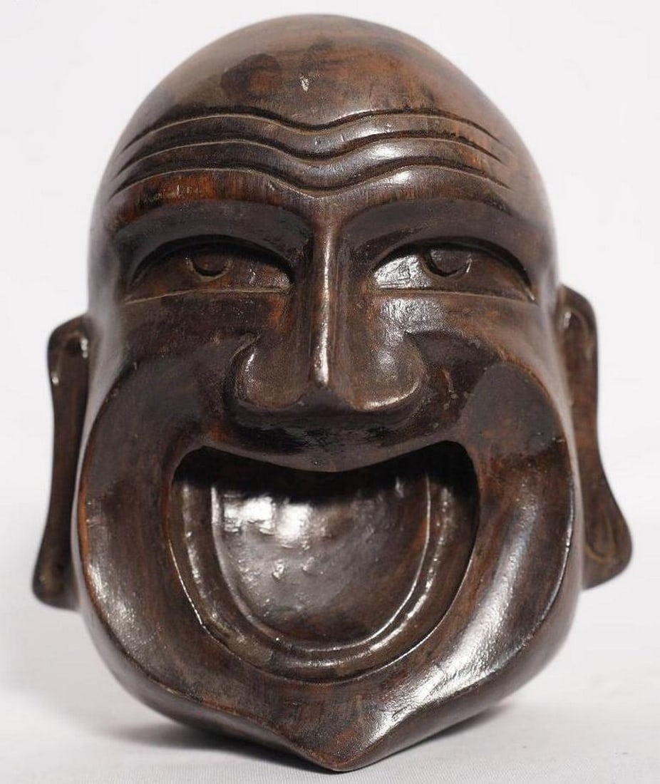 8" Laughing Buddha Face Handmade White Wood Figurine: 8" Laughing Buddha Face Handmade White Wood Figurine This finely handcrafted wooden figurine depicts the Laughing Buddha, also known as Hotei or Pu-Tai, with a wide, joyous grin that radiates happ