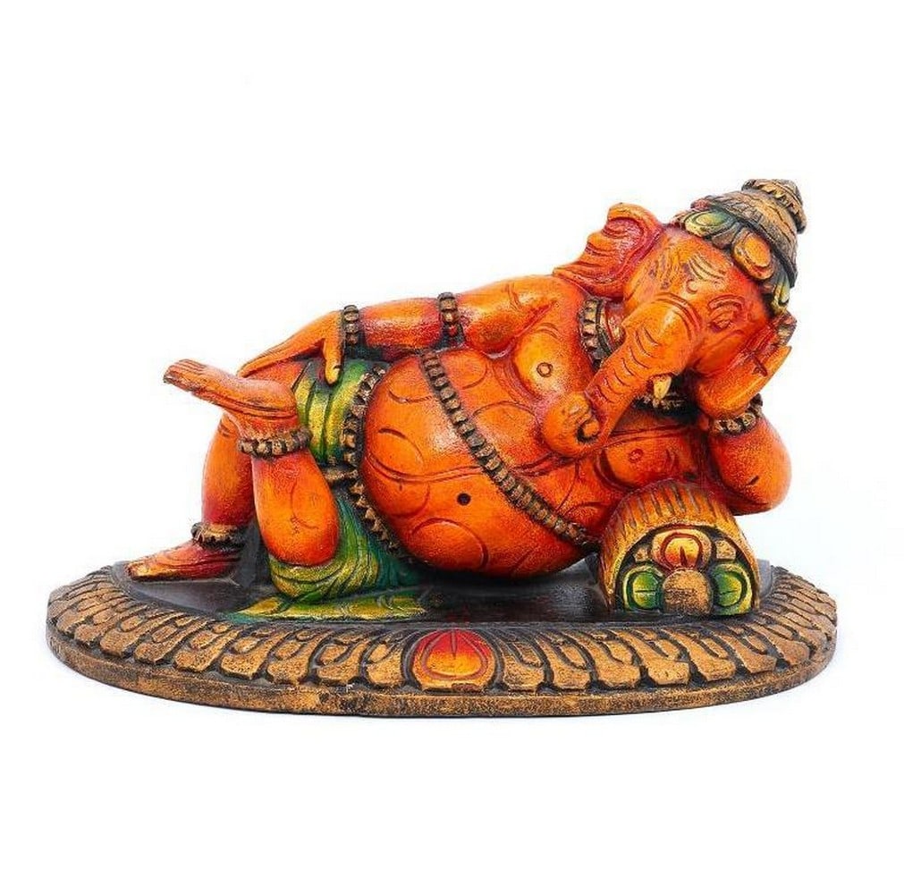 Relaxing Bhagawan Ganesha Wood Carving: Relaxing Bhagawan Ganesha Wood Carving This intricately handcrafted wooden sculpture depicts Bhagawan Ganesha in a serene moment of repose, resting gently on his side with a soft, peaceful smile. Unli