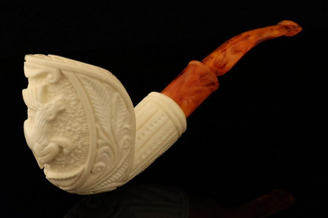Hand-Carved Deer Block Meerschaum Pipe with Fitted Case: Hand-Carved Deer Block Meerschaum Pipe with Fitted Case This block meerschaum pipe features an intricately hand-carved deer design, highlighting fine craftsmanship and a smooth, polished finish. The p