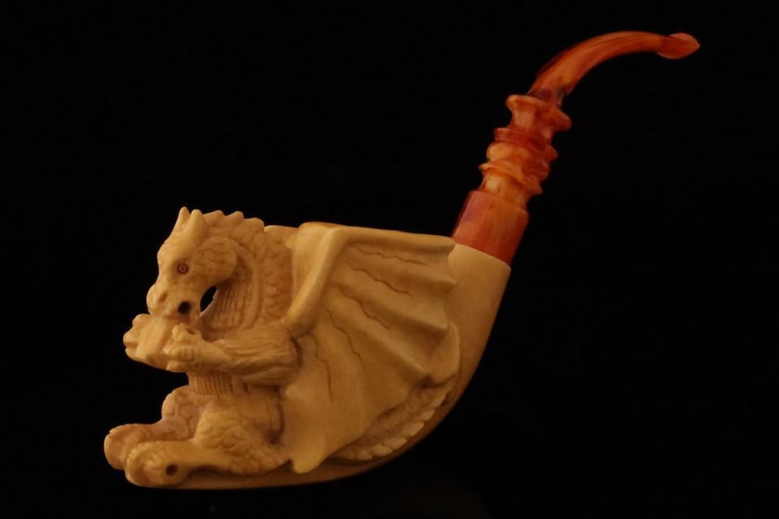 Majestic Dragon Block Meerschaum Pipe with Fitted Case: Majestic Dragon Block Meerschaum Pipe with Fitted Case This finely crafted Dragon Block Meerschaum Pipe features intricate detailing and comes with a fitted protective case. Expertly carved to showcas