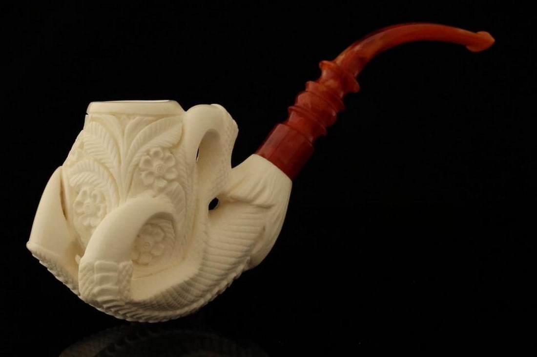 Regal Eagle Talon Meerschaum Pipe with Fitted Case: Regal Eagle Talon Meerschaum Pipe with Fitted Case Experience the perfect blend of artistry and function with this hand-carved Eagle Talon Meerschaum Pipe. Crafted with meticulous attention to detail,