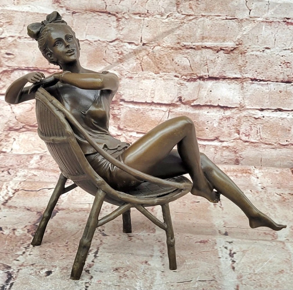 Art Deco Woman Lounging in Wicker Chair Bronze Sculpture: Art Deco Woman Lounging in Wicker Chair Bronze Sculpture Custom Made Bronze Sculpture Featuring An Elegant Art Deco Woman Relaxing In A Finely Detailed Wicker Chair, Capturing The Sophistication And L