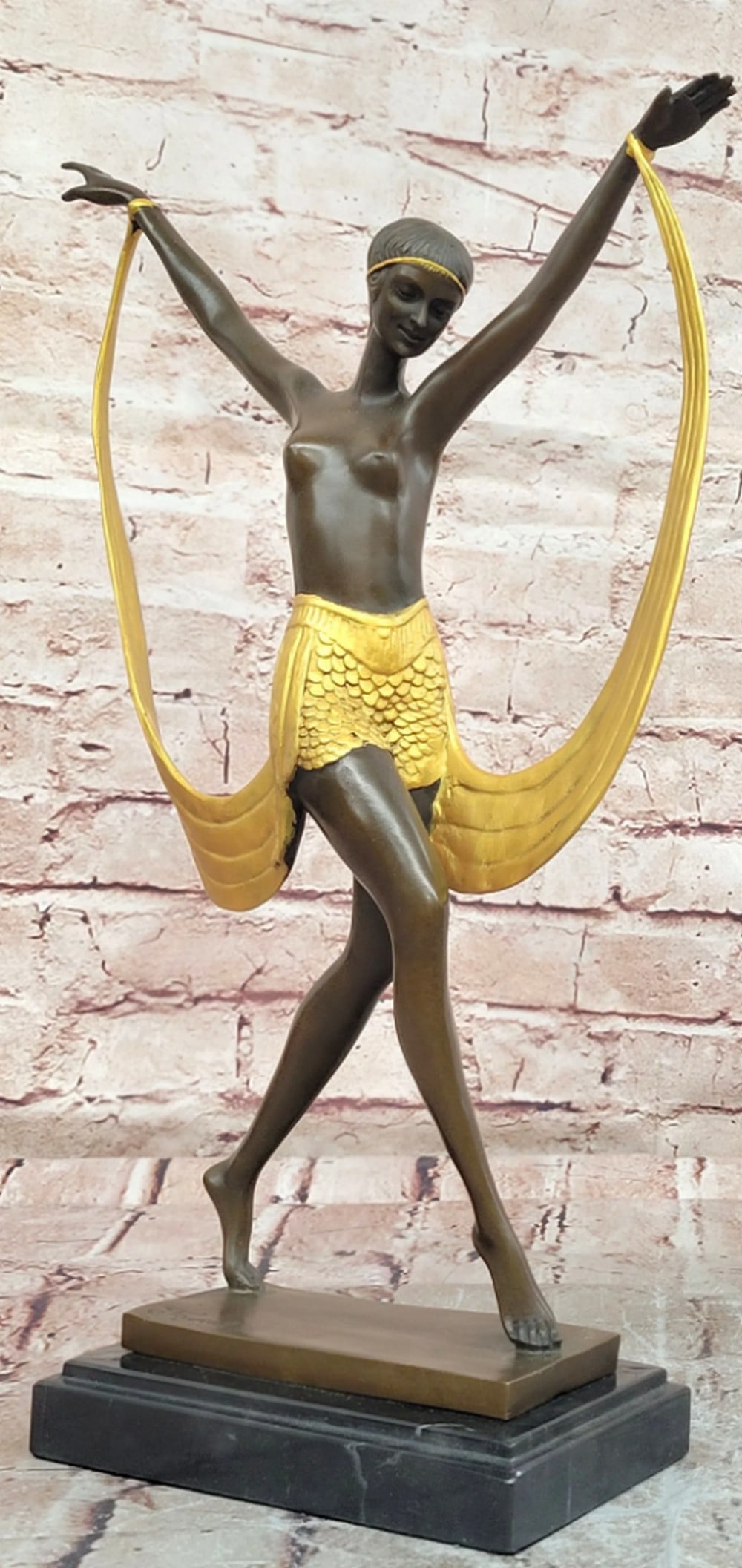 Bronze Art Deco Style Dancer Sculpture on Marble Base - 15" x 10": Bronze Art Deco Style Dancer Sculpture on Marble Base - 15" x 10" This bronze sculpture depicts a dancer in a poised, elevated stance, capturing a sense of movement and balance. The figure is 