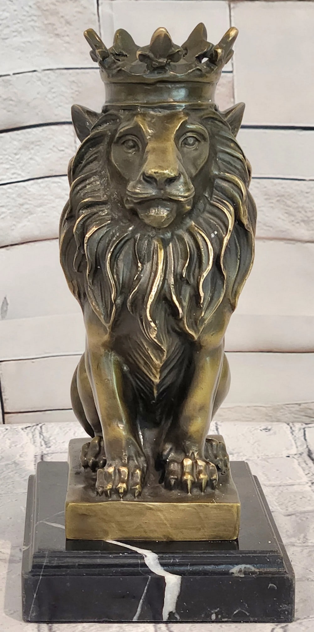 Crowned Lion Bronze Sculpture by Miguel Lopez - 10" x 6": Crowned Lion Bronze Sculpture by Miguel Lopez - 10" x 6" Introducing a Powerful Bronze Sculpture: This depiction of a crowned lion is meticulously handcrafted with careful attention to detail.