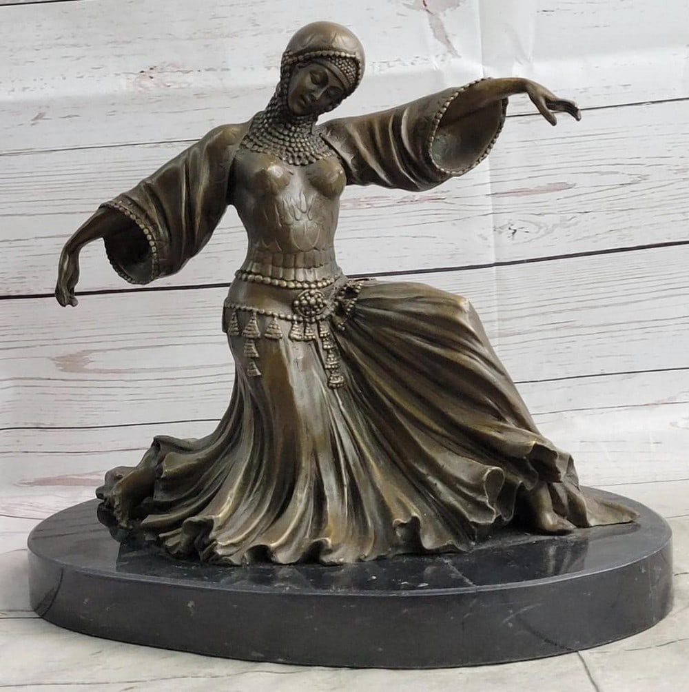 Graceful Kneeling Dancer Bronze Sculpture: Graceful Kneeling Dancer Bronze Sculpture This sculpture of a dancer is spectacular and divine in every detail you can find. She kneels down and ends her performance proudly, as she looks down. She we