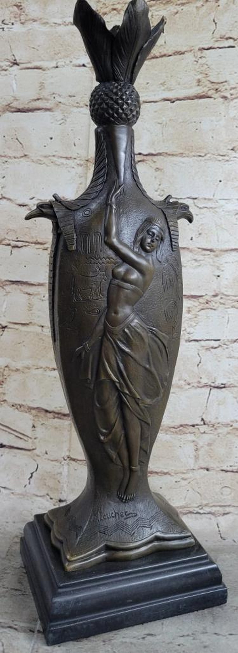 Bronze Egyptian Dancer Sculpture Inspired by Louchet - 17.5" x 5": Bronze Egyptian Dancer Sculpture Inspired by Louchet - 17.5" x 5" This unique bronze sculpture evokes the timeless beauty of ancient Egypt, featuring a young woman dancing gracefully against a