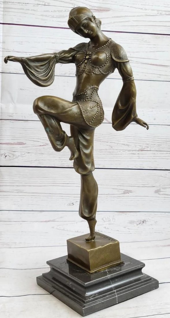Antique Art Deco Bronze Sculpture: Signed Chiparus Dancer, Vintage Theatre and Opera Drama Influence: Emerging gracefully from behind a curtain, the Egyptian belly dancer delicately steps forward, her left leg kicked up, poised on tiptoes, and her head subtly cocked. She presents herself to the audien
