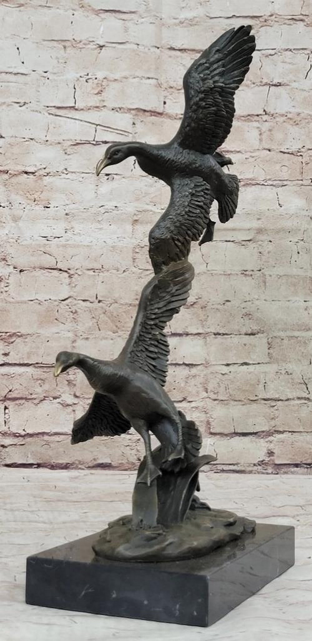 Ducks in Flight" Inspired Bronze Statue - 17" x 15: "Ducks in Flight" Inspired Bronze Statue - 17" x 15" This 'Ducks in Flight' inspired bronze statue beautifully captures the dynamic grace of two ducks ascending in unison. The fluidity