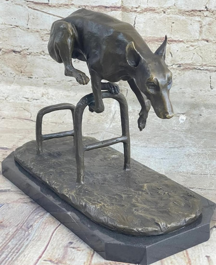 Signed Original Jumping Dog Bronze Sculpture - 9" x 12": Signed Original Jumping Dog Bronze Sculpture - 9" x 12" This high energy dog jumps the hurdles with skill and vivacity, demonstrating his talented and adventurous nature.This bronze patina scu