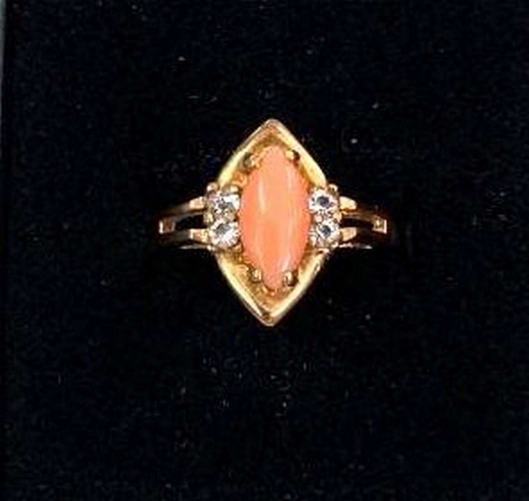 Marquise Cut Coral Ring: Marquise Cut Coral Ring Elevate your style with this captivating 18KTGP yellow gold electroplated ring, featuring a striking marquise-cut coral gemstone as its centerpiece. Warm, vibrant, and beautifu