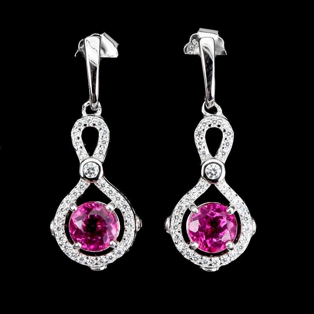 Pink Topaz 6mm Simulated Cz Gemstone 925 Sterling Silver Earrings: Pink Topaz 6mm Simulated Cz Gemstone 925 Sterling Silver Earrings These earrings are designed to catch the light beautifully, adding a touch of sparkle and glamour to any outfit. Ideal for special occ