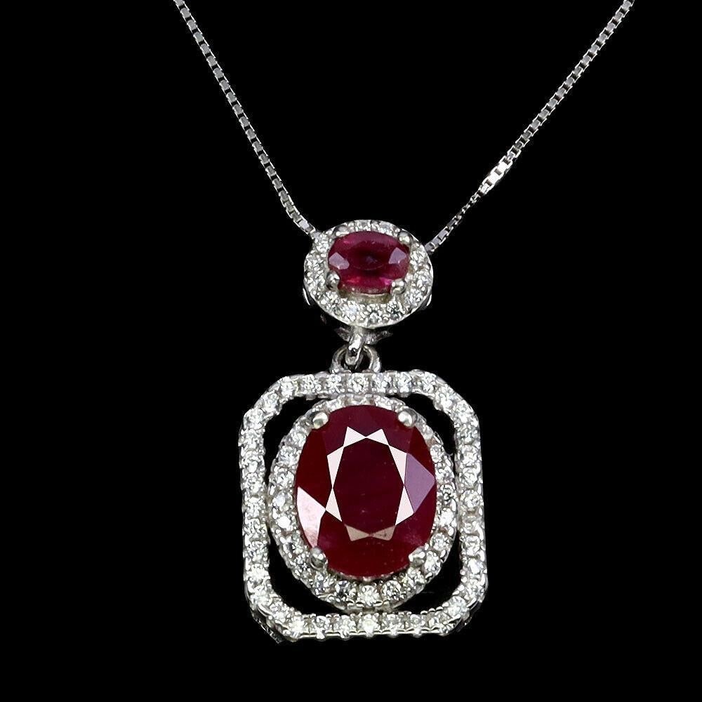 Scarlet Elegance Oval Ruby 9x7mm Necklace: Scarlet Elegance Oval Ruby 9x7mm Necklace Elevate your look with the timeless allure of our Scarlet Elegance Oval Ruby Necklace. This exquisite piece features a captivating oval-shaped ruby, renowned 