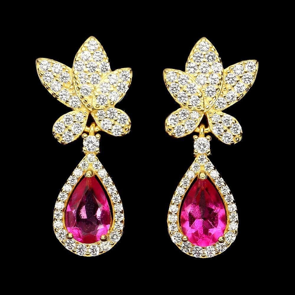 Pear Pink Topaz and Cz 925 Sterling Silver Stud Earrings: Pear Pink Topaz and Cz 925 Sterling Silver Stud Earrings At the heart of these earrings are two lustrous pear-shaped Pink Topaz gemstones, renowned for their soft, romantic hue and remarkable brillian