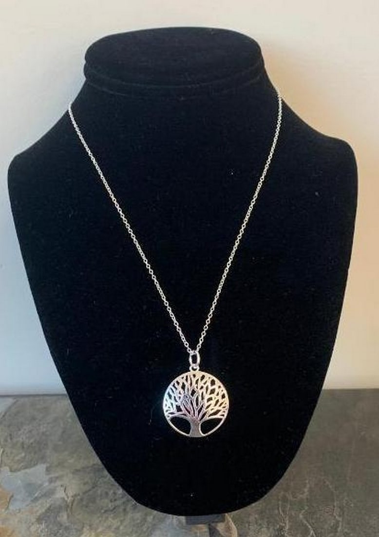 Elegant Tree of Life Pendant Necklace: Elegant Tree of Life Pendant Necklace Celebrate growth, strength, and connection with this beautifully crafted Tree of Life pendant necklace. Featuring an intricately cut circular design, the delicate