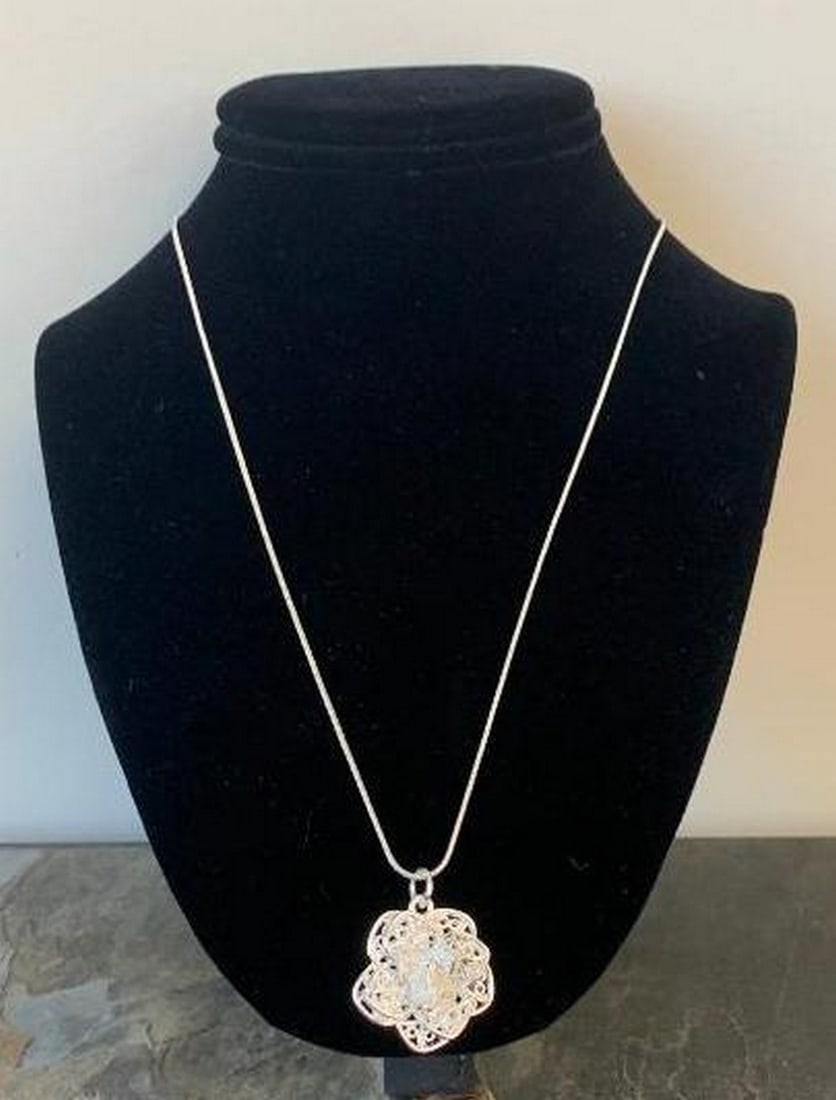 Forever Bloom Silver Pendant Necklace: Forever Bloom Silver Pendant Necklace Capture the beauty of nature with this silver flower pendant necklace. Expertly crafted, the delicate floral design features polished petals that shimmer with lig