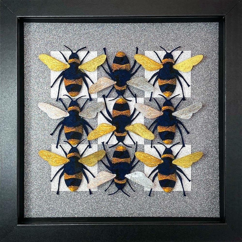 Making A Bee Line' Handcrafted Bee Wall Art by Amanda Deadman Art: 'Making A Bee Line' Handcrafted Bee Wall Art by Amanda Deadman Art This deep box framed artwork features nine hand-cut and hand-painted watercolour bees arranged on silver and grey checked glitter car