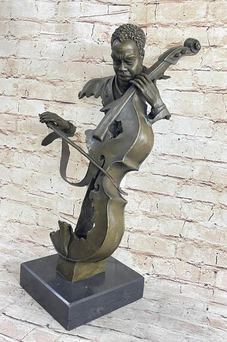 Musician Playing the Cello Bronze Sculpture - 20" x 14": Musician Playing the Cello Bronze Sculpture - 20" x 14" Indulge in the captivating fusion of classic blues and jazz with this bronze bust sculpture, a masterpiece depicting a Black musician im